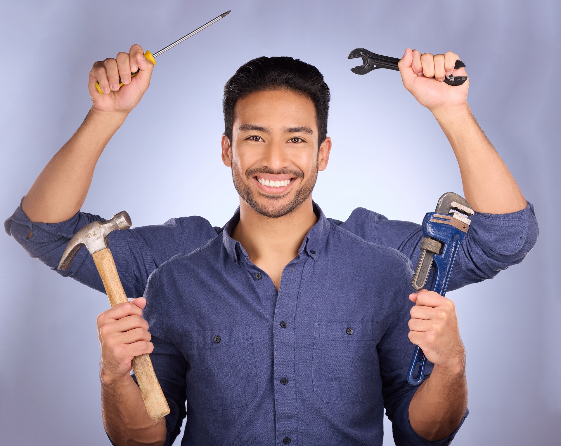 Handyman, builder tools and portrait of mulitask engineering of a man ready for construction work. Diy, home renovation project and happiness of a model with isolated studio background with arms